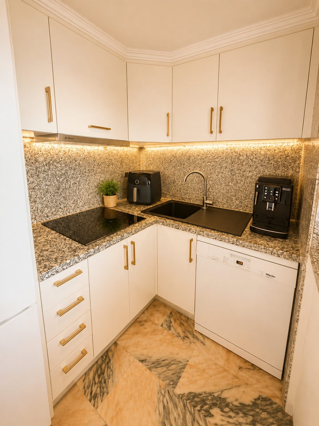 Kitchen with induction hob and coffee machine