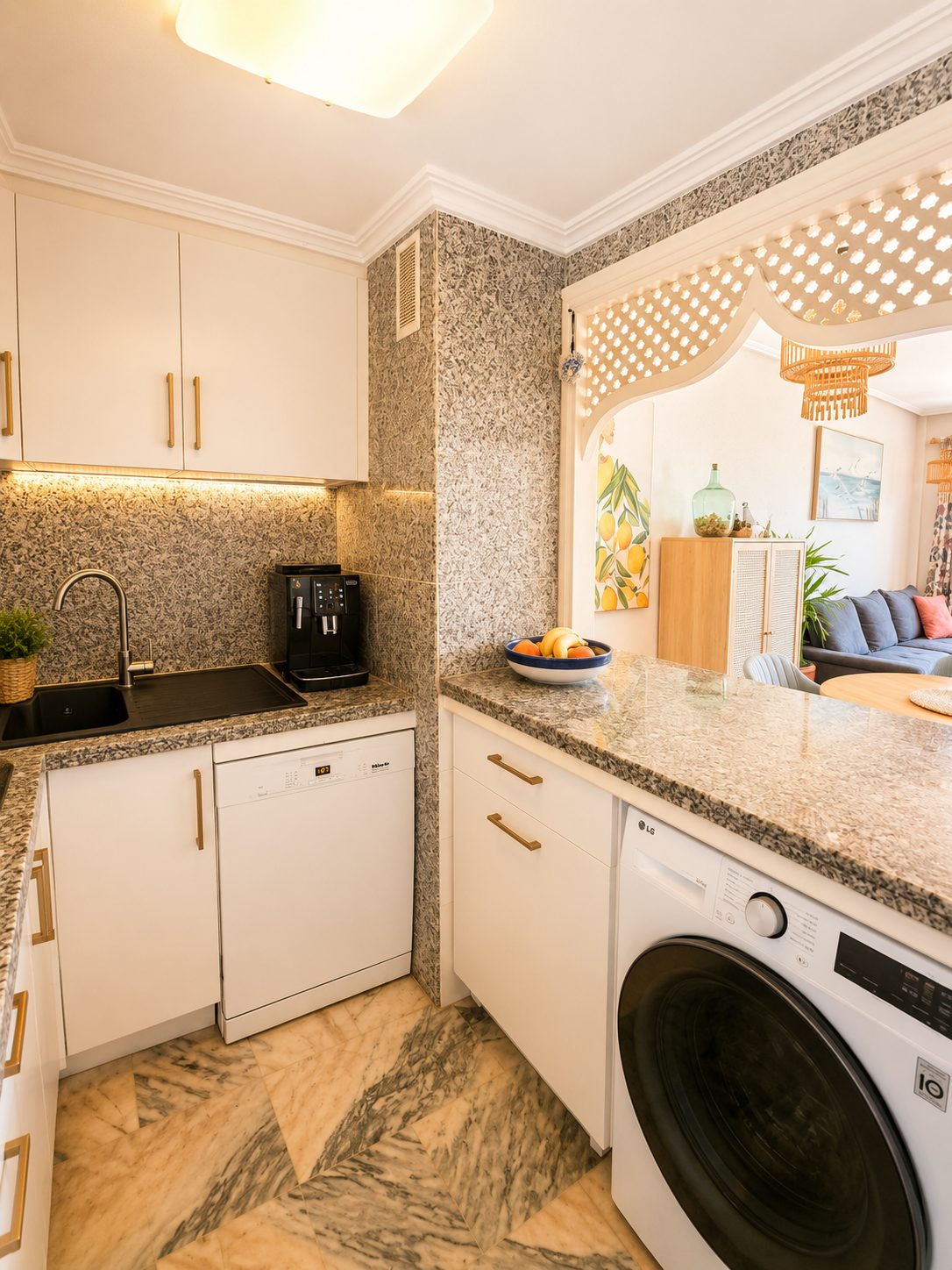 Kitchen with washing machine, open to the living room