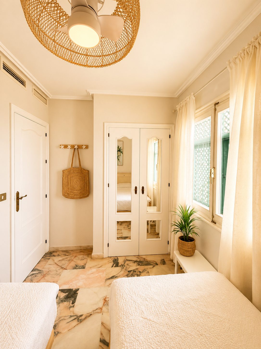 Second bedroom with mirrored wardrobe and ceiling fan